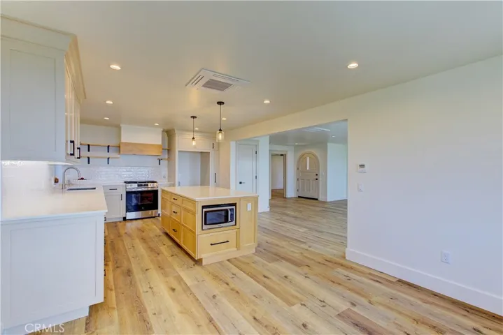 View from the nook through kitchen and open living room