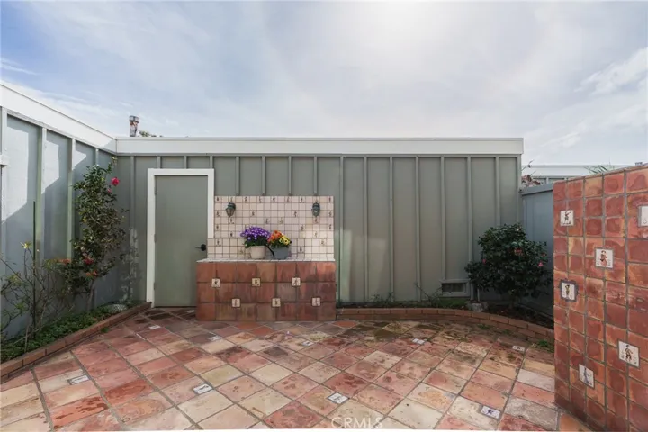 Private Patio leading to 2 car garage & laundry area