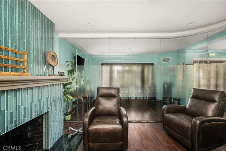 Glass tile fireplace in glass enclosed room which can be used as
a conference or IV room