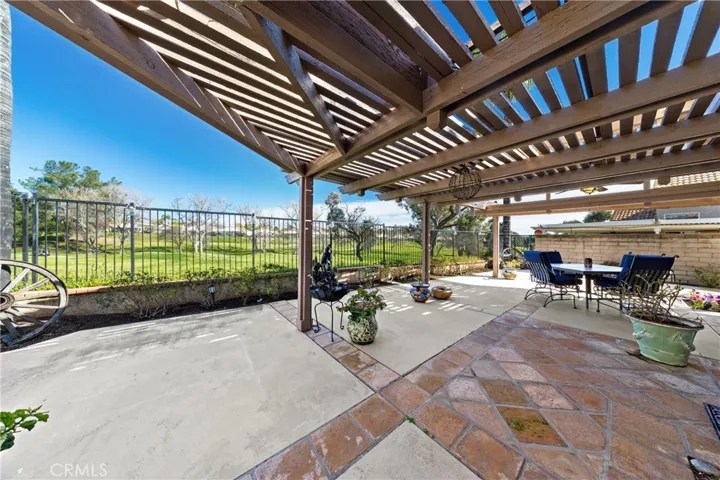 Patio with tile accents and golf views.