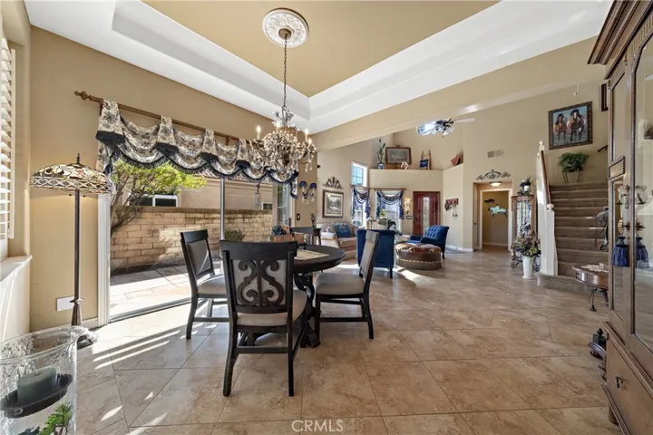 Look how spacious and open this plan is.  Note the beautiful ceiling details in the dining room.  (Chandelier is not included.)