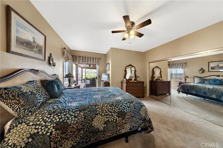 Spacious primary bedroom has both a "California style" walk-in closet and a wall closet.
