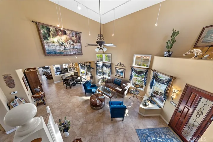 View from the stairs down to the living and dining rooms.   This home flows seamlessly from room to room.