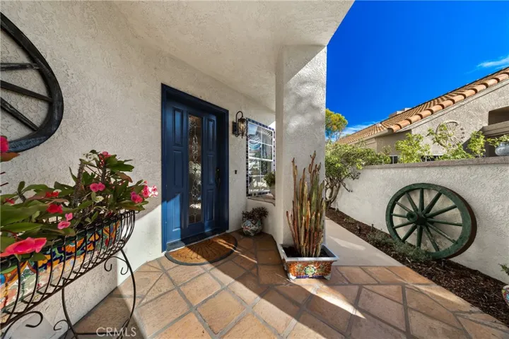Your tile entry and door with leaded glass panel offers a welcoming first impression.
