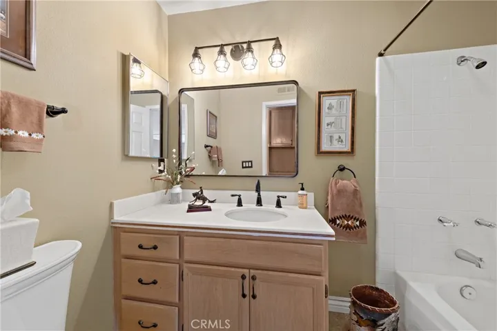 Upstairs bathroom has a tub/shower and  upgraded lighting and fixtures.