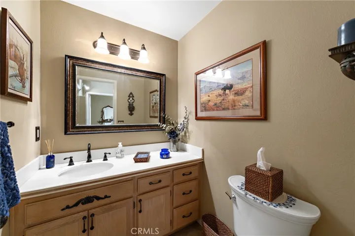 Half bath (downstairs) is perfect for guests with upgraded fixtures, lighting and mirrors.