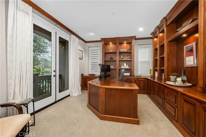 Office with rich cabinetry
