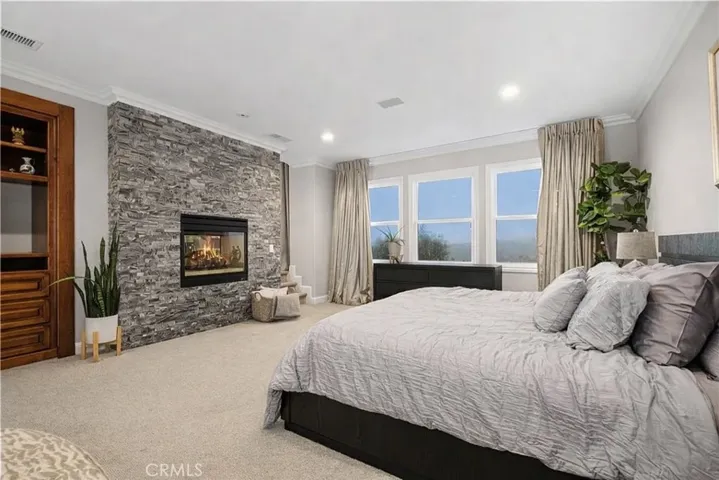 Modern bedroom with cozy fireplace