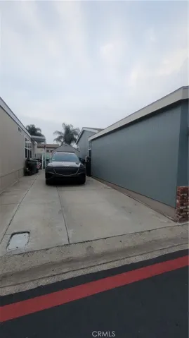 driveway adjacent to home ( for 2 cars )