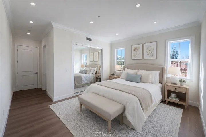 First floor bedroom 2 with ensuite bathroom. It is digitally staged.