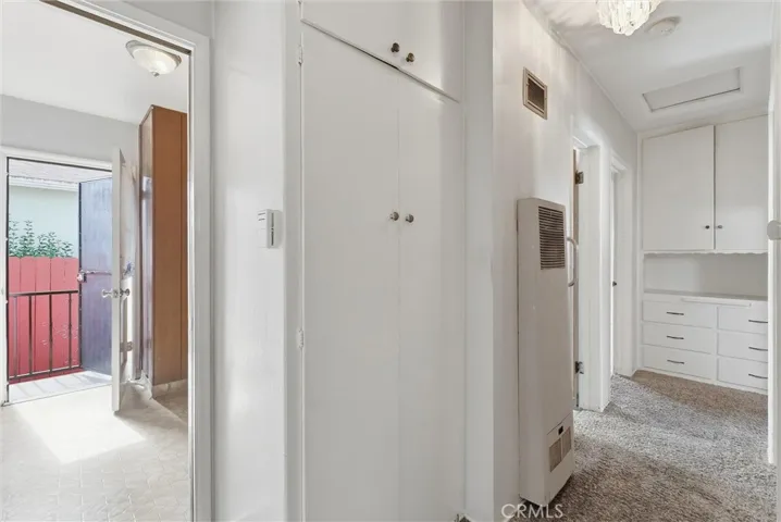 Hallway with closet and original built-in.