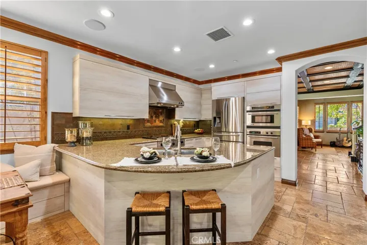 Closer View of the Kitchen, Dining Room Beyond.