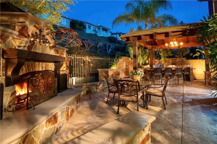 Outdoor entertaining in the backyard after sunset.