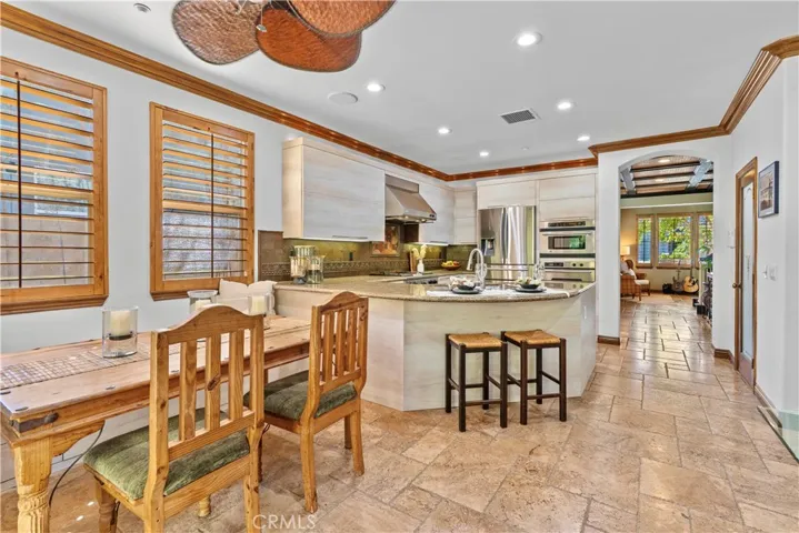 Reverse View of the Kitchen from the back door to the Dining Room beyond.