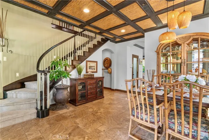 View from the Front Entry into the Dining Room and Stairs to the Second Floor.