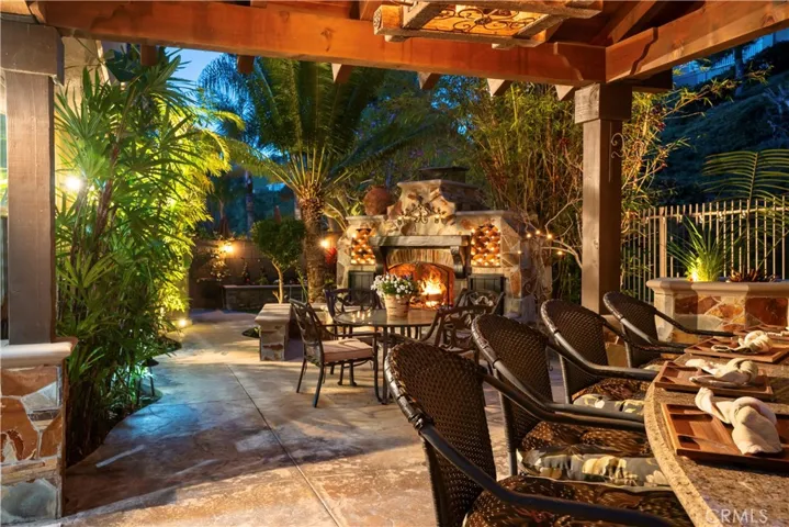 Dining outside under the Pergola at dusk.