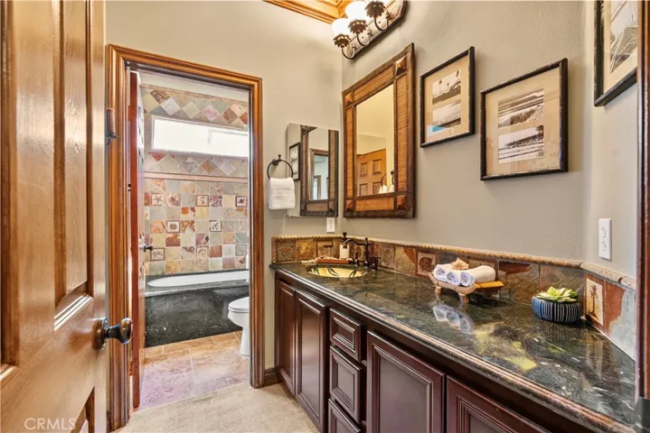 Bathroom #3 with marble countertops.