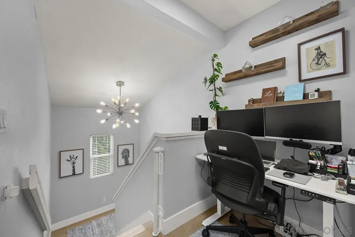 open office area at top of stairs, 3rd floor.