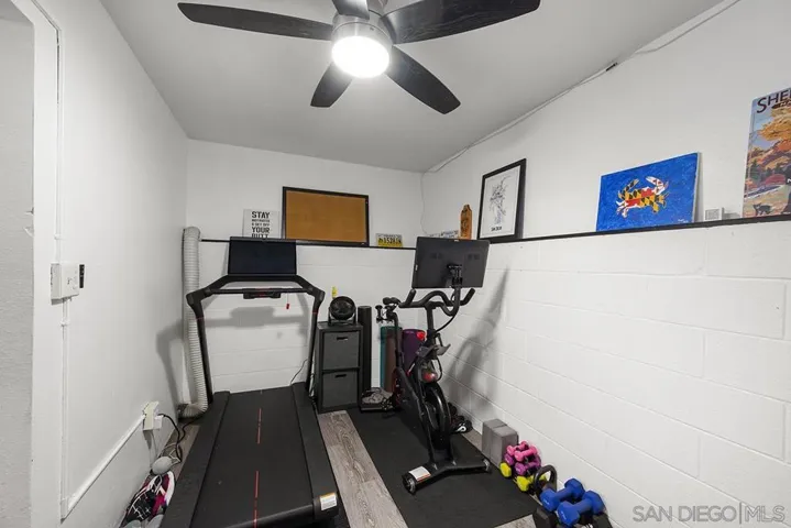 located at rear of garage; currently being used as mini-gym