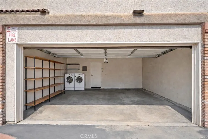 2 car garage photo was edited by removing storage in garage and adding furniture