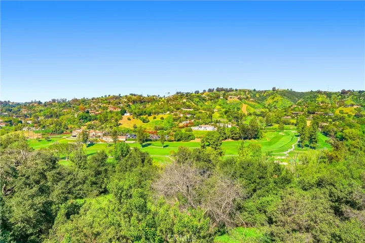 Sitting below the home is the Clubhouse at the Hacienda Golf Club, a private course founded by Alphonso Bell, who later founded the Bel Air Country Club.