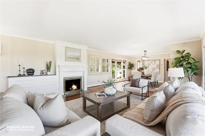 Living and Dining Room with Gas Fireplace and neutral interior paint.