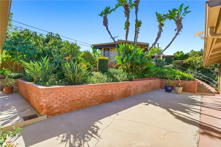 The lower patio area sits off the Guest Quarters, Bonus Room, and Garage!