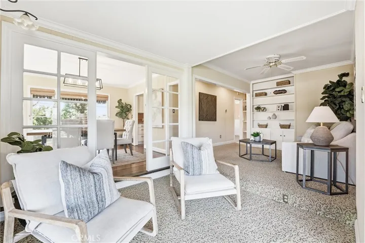 The den has great built-ins and is a perfect spot to sit and read or catch up with friends and family!