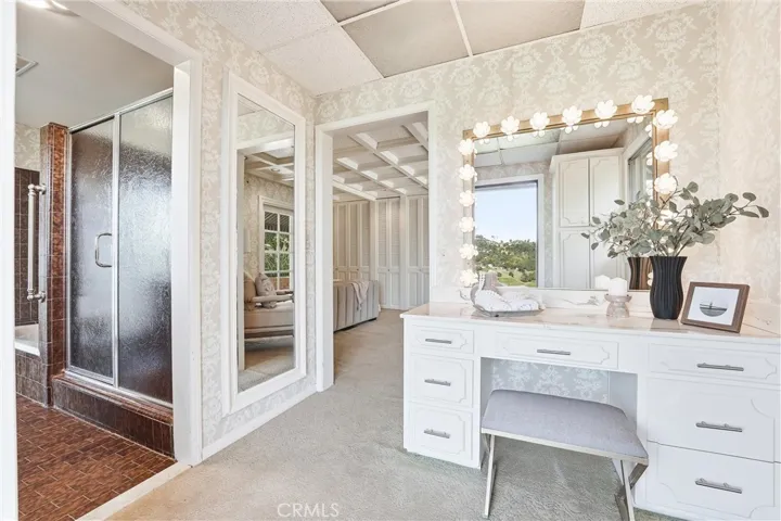Vanity area and bathroom complete with large soaking tub and separate walk-in shower!