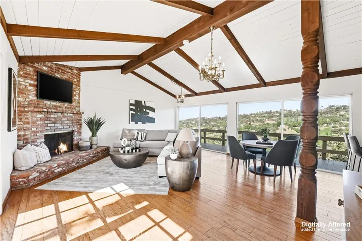 Bonus Room with vaulted ceilings, brick fireplace, two large sliders that open to the back deck, and again stunning views!