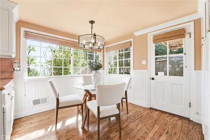 This eat-in breakfast nook has corner windows with Southwest facing views and access to the side yard.