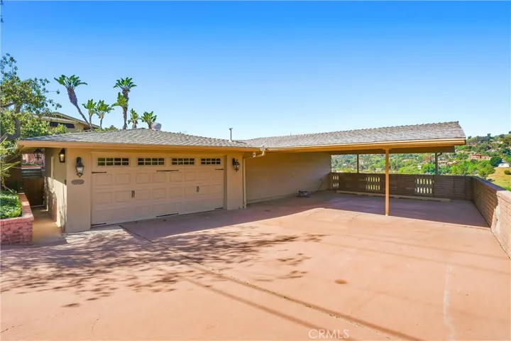 2 car detached garage with large carport that can easily park 3-4 vehicles, and a large driveway to accommodate your boat and/or RV!