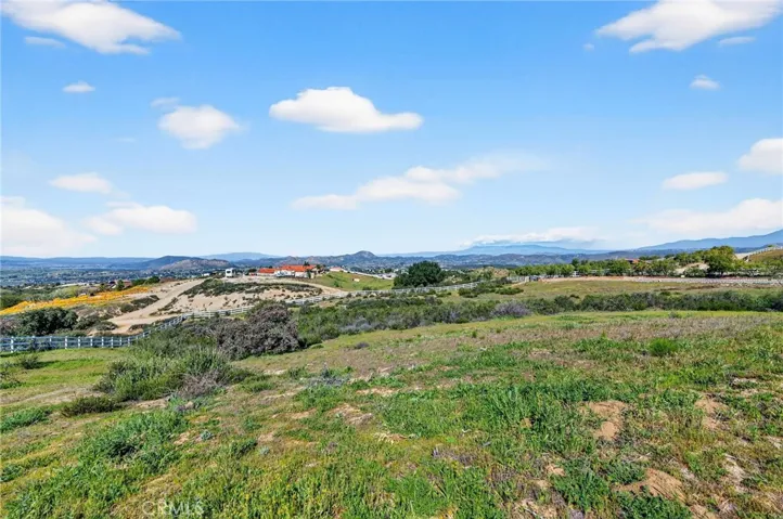 Breathtaking panoramic views stretch across the valley and surrounding hills, delivering privacy and a true sense of open space.