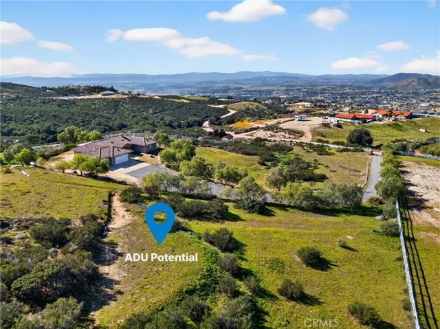 39475 Bruce  Ln aerial with ADU Potential Area – Wide aerial view illustrates the property’s spacious grounds, offering potential for additional improvements.