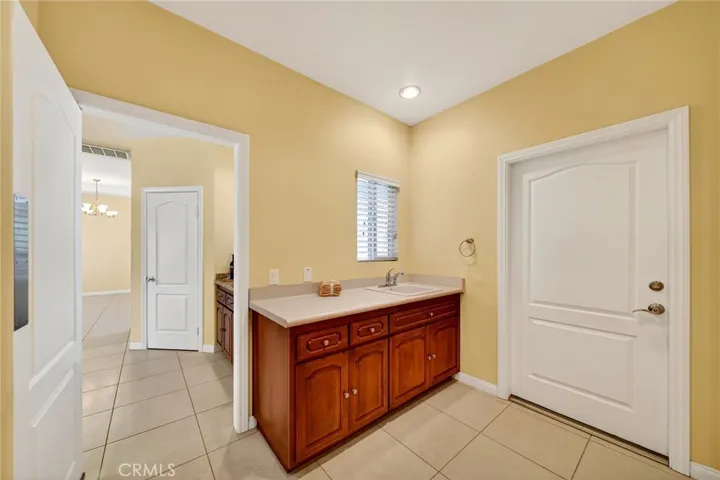 laundry room with utility sink