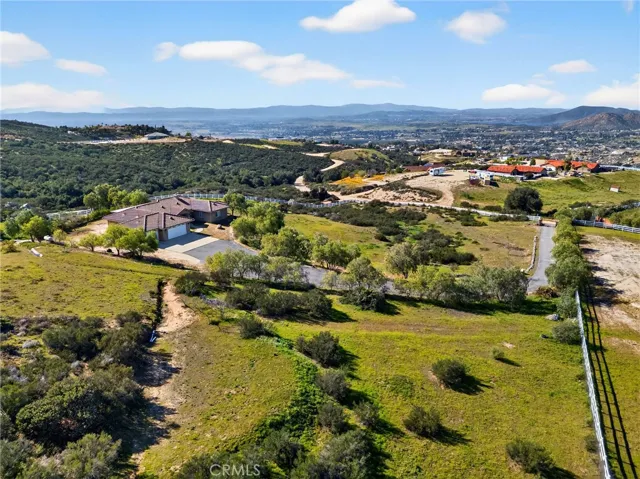 39475 Bruce Ln. panoramic Aerial Views – Stunning bird’s-eye perspective captures miles of rolling countryside, neighboring homes, and distant mountain ranges.