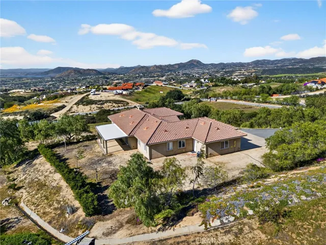 39475 Bruce Ln rear Aerial Exterior – Drone view from behind the home emphasizes the covered patio.