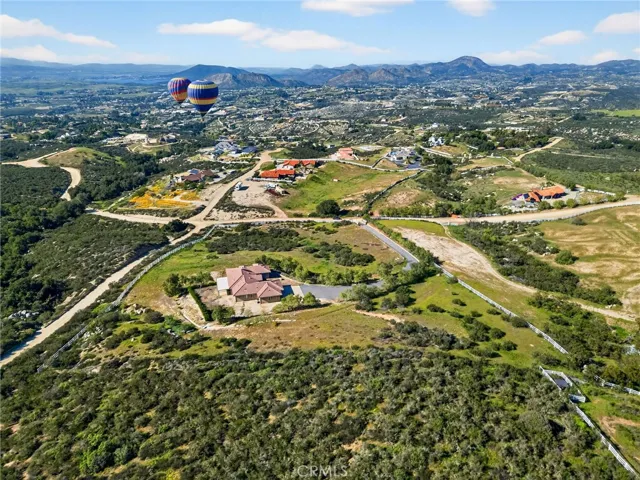 39475 Bruce Ln aerial Community & Landscape View drone perspective highlights the property’s elevated position, surrounding open space, and panoramic views stretching across rolling hills and neighboring estates.