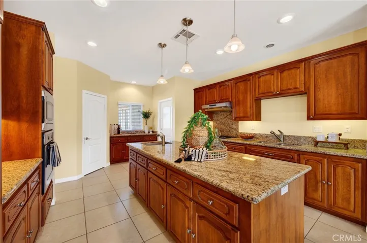 39475 Bruce Ln. island anchors the kitchen while overlooking the dining