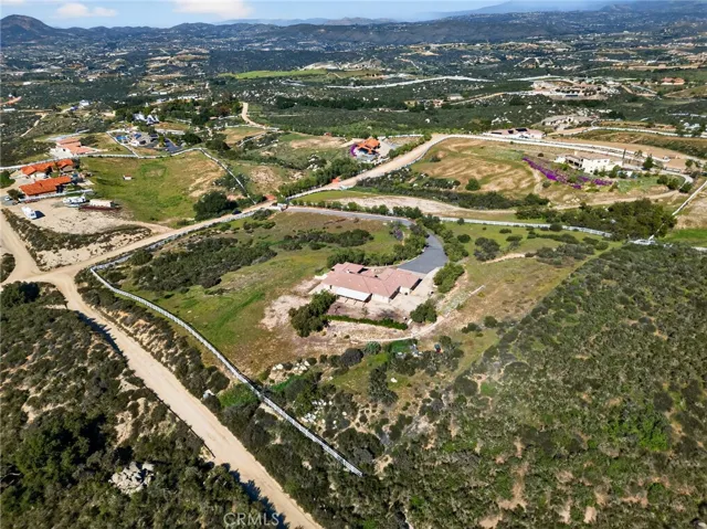 39475 Bruce Ln surrounding Community Views  highlights the tranquil rural setting, winding roads, and expansive open space that define the area.