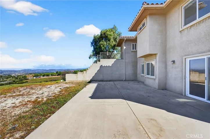 39475 Bruce Ln side patio offers a private entrance to the bonus room