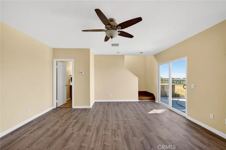 39475 Bruce Ln Bonus Room / Lower-Level Living Area – With direct access to the outdoors and proximity to a half  bathroom.