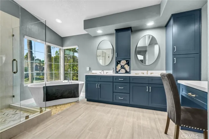 Master bath with soaking tub, double sinks and beauty vanity.