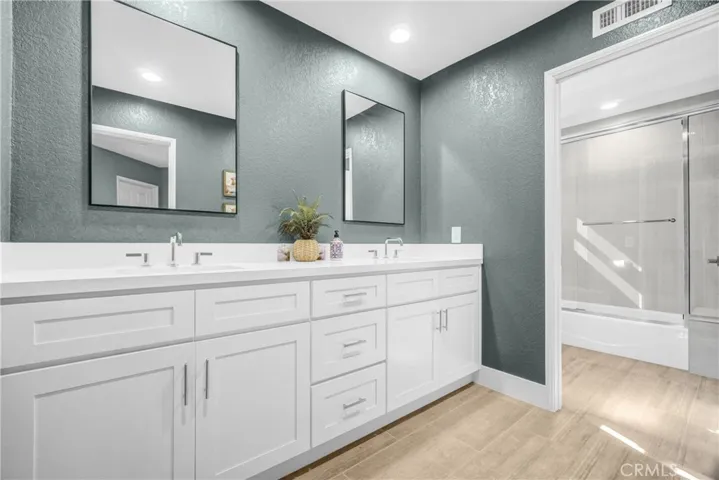 Upstairs updated bathroom with double sinks