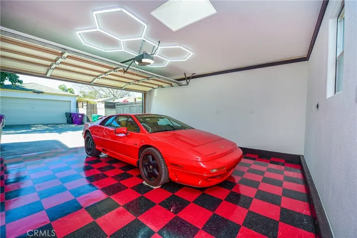 Fully finished garage with fantastic checkerboard styling. DON'T forget the EV CHARGER and custom lights.