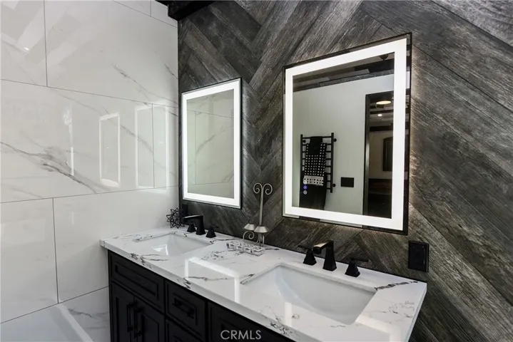 Primary bath suite with lighted mirrors