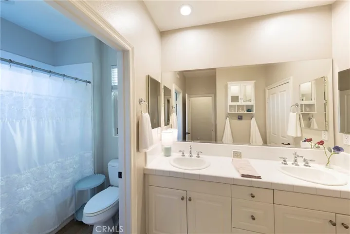 Jack and Jill bathroom with door separating shower