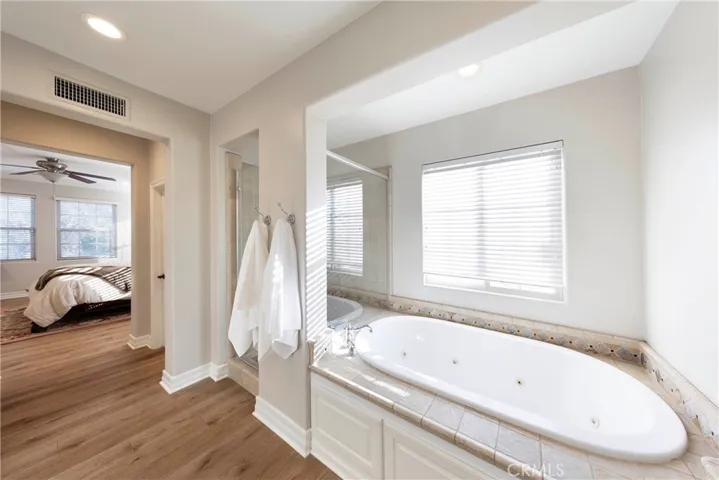 Primary en suite with separate shower and soaking tub