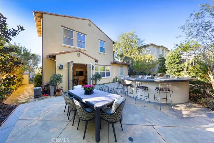 Back yard with generous room for a large dining table.