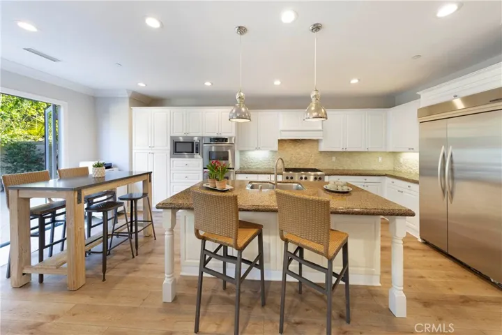 Kitchen and breakfast nook lead to back yard